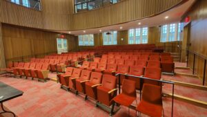 View of seating with accessible seating areas on left and right sides of auditorium
