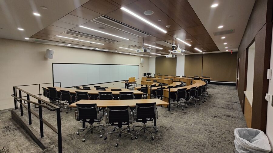 View of room as you enter, with ramp to access the front of the room to the left, or smooth floor to right to move around the room.