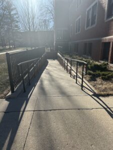 Younker Hall accessible ramp as seen going towards the building entrance