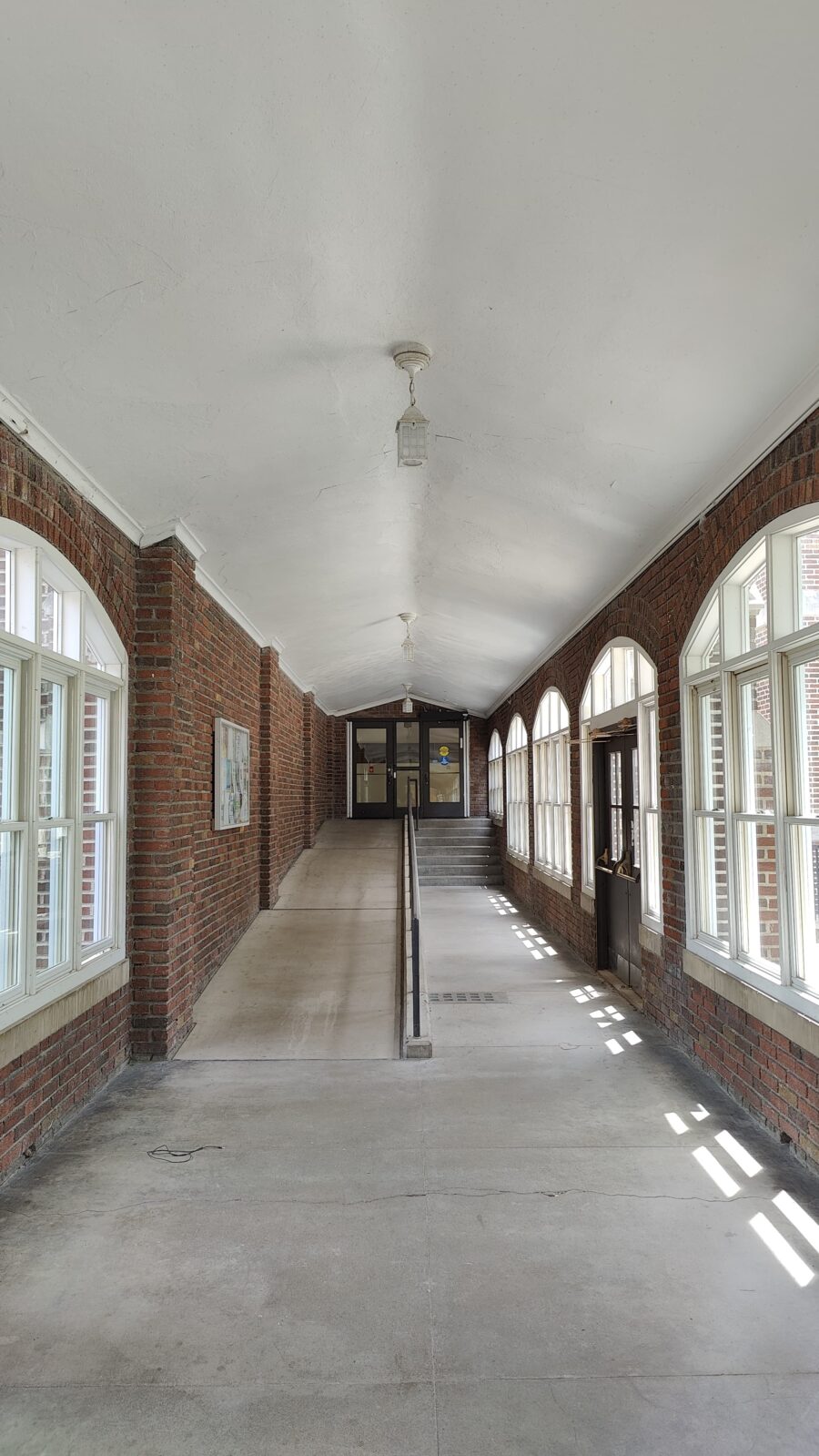 Accessible entrance to Main Hall inside South Loggia. Ramp is on left (stairs on right).