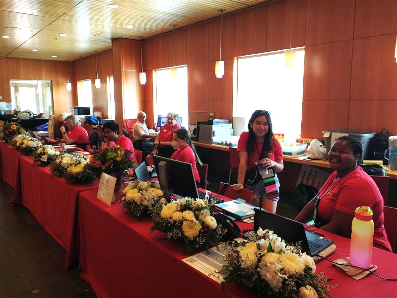 The staff at the Reunion Check-in desk ready to welcome alums home!
