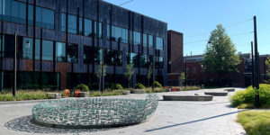 Kington Plaza facing northeast, view of sculpture and stone benches