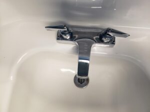 Faucet style: 2 handles, pull towards you