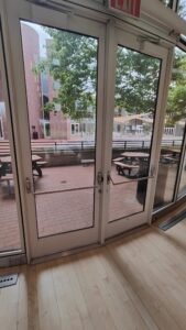 Interior of doors that lead from the dining hall outside to the JRC courtyard, opened by push-bar mechanism