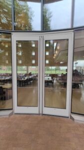 Doors leading from JRC courtyard into the JRC dining hall - locked this direction except for special occasions. These are normally exit-only doors.