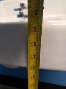 Sink height: 27.5 inches from floor to bottom of sink, 30.5 inches top