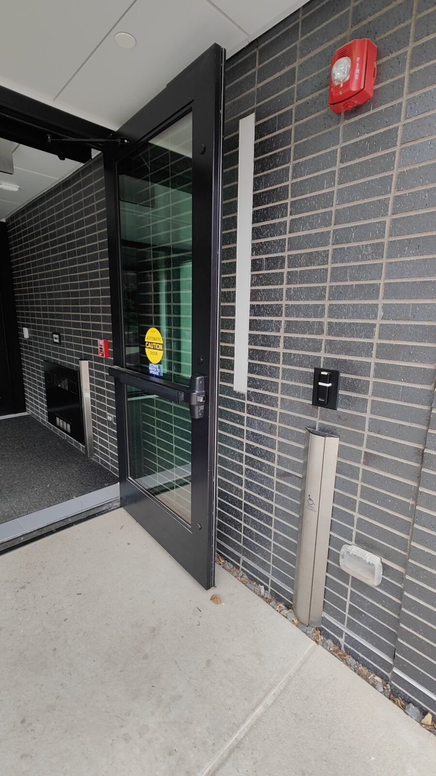Door to Norris Hall, with p-card scanner and door opener on right
