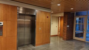 View upon exiting 2nd floor elevator and turning left (south). Door to JRC 209-B is the wooden interior door, to the left (east) of the glass doors that exit to a 2nd floor patio (almost always locked).