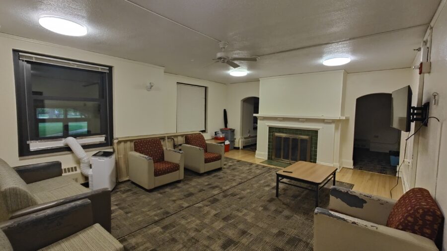 View of lounge as you enter, with seating and low tables